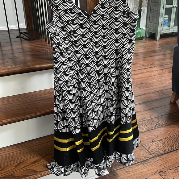 Classic, fitted, fully lined with a flare@ bottom hem. - Picture 2 of 4